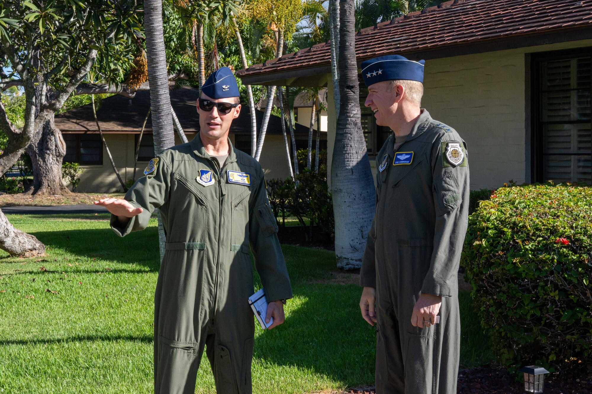 A Colonel speaks to a General outside.