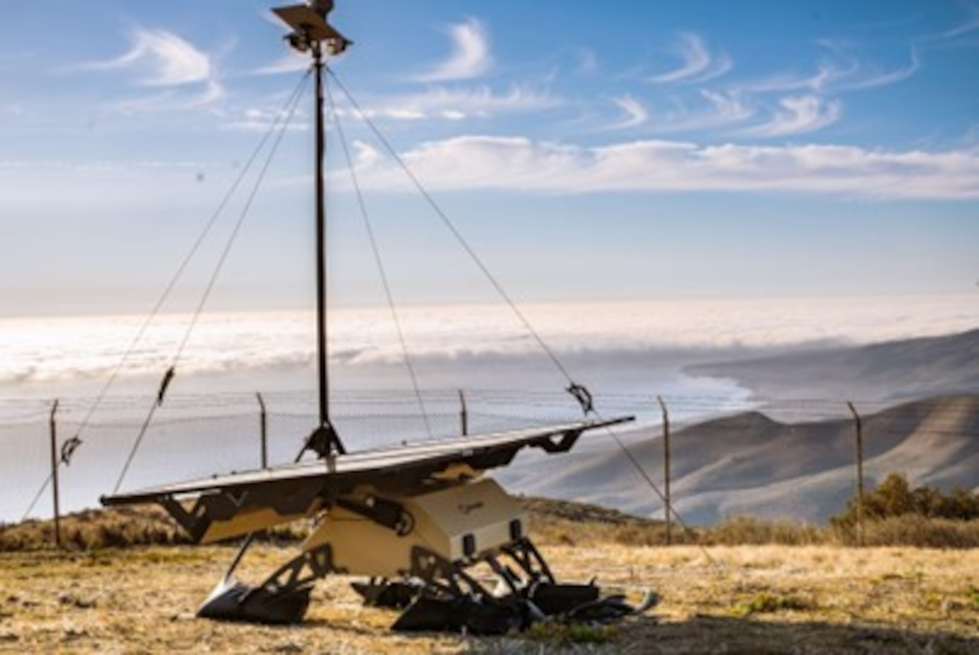 a piece of fire detection technology stands on a hill