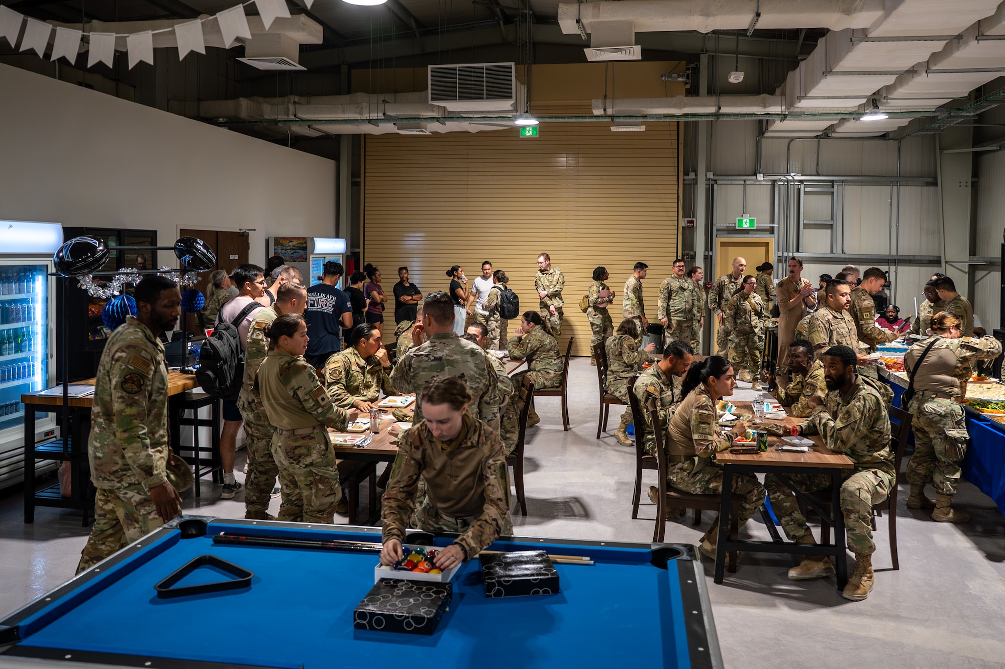 Airmen gather in a newly constructed facility