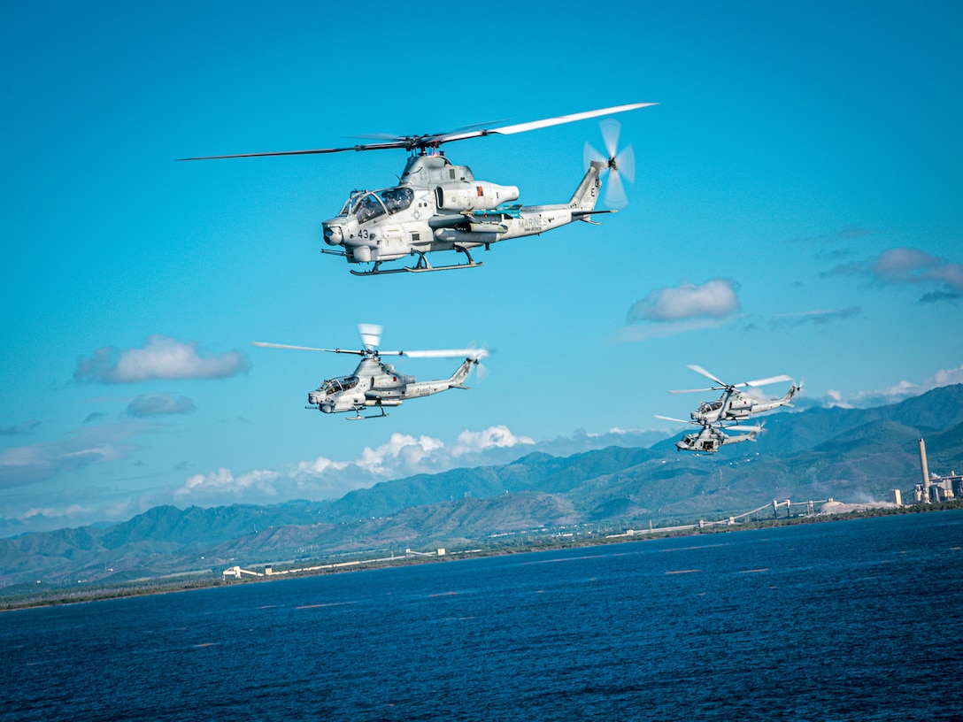 CARIBBEAN SEA – U.S. Marine Corps AH-1Y Cobra and UH-1Y Huey helicopters with Marine Medium Tiltrotor Squadron 263 (Reinforced), 22nd Marine Expeditionary Unit (Special Operations Capable), fly in a formation from aboard the U.S. Navy Wasp-class amphibious assault ship USS Iwo Jima (LHD 7), during amphibious operations in Puerto Rico while underway in the Caribbean Sea, Sept. 5, 2025. As part of their assigned responsibilities to ensure global reach and readiness, the services routinely provide U.S. Southern Command with resources, capabilities, and personnel to support its mission, War Department-directed operations, and the President’s priorities. (U.S. Marine Corps photo by Sgt. Tanner Bernat)