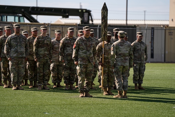 46th Chemical Company cases unit colors during inactivation ceremony on Fort Bliss