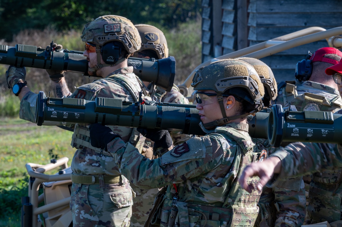 U.S. Air Force security forces Airmen aim AT4 rocket launcher simulators.