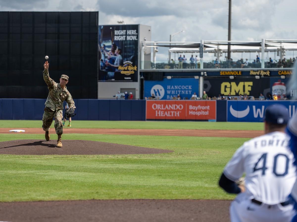 U.S. Air Force Col. Edward Szczepanik, 6th Air Refueling Wing commander, throws the first pitch during the Tampa Bay Rays baseball game in Tampa, Florida, Sept. 18, 2025. The Rays  recognized the 78th anniversary of the Air Force by hosting service members from MacDill Air Force Base at the game. (U.S. Air Force photo by Staff Sgt. Christopher Tam)