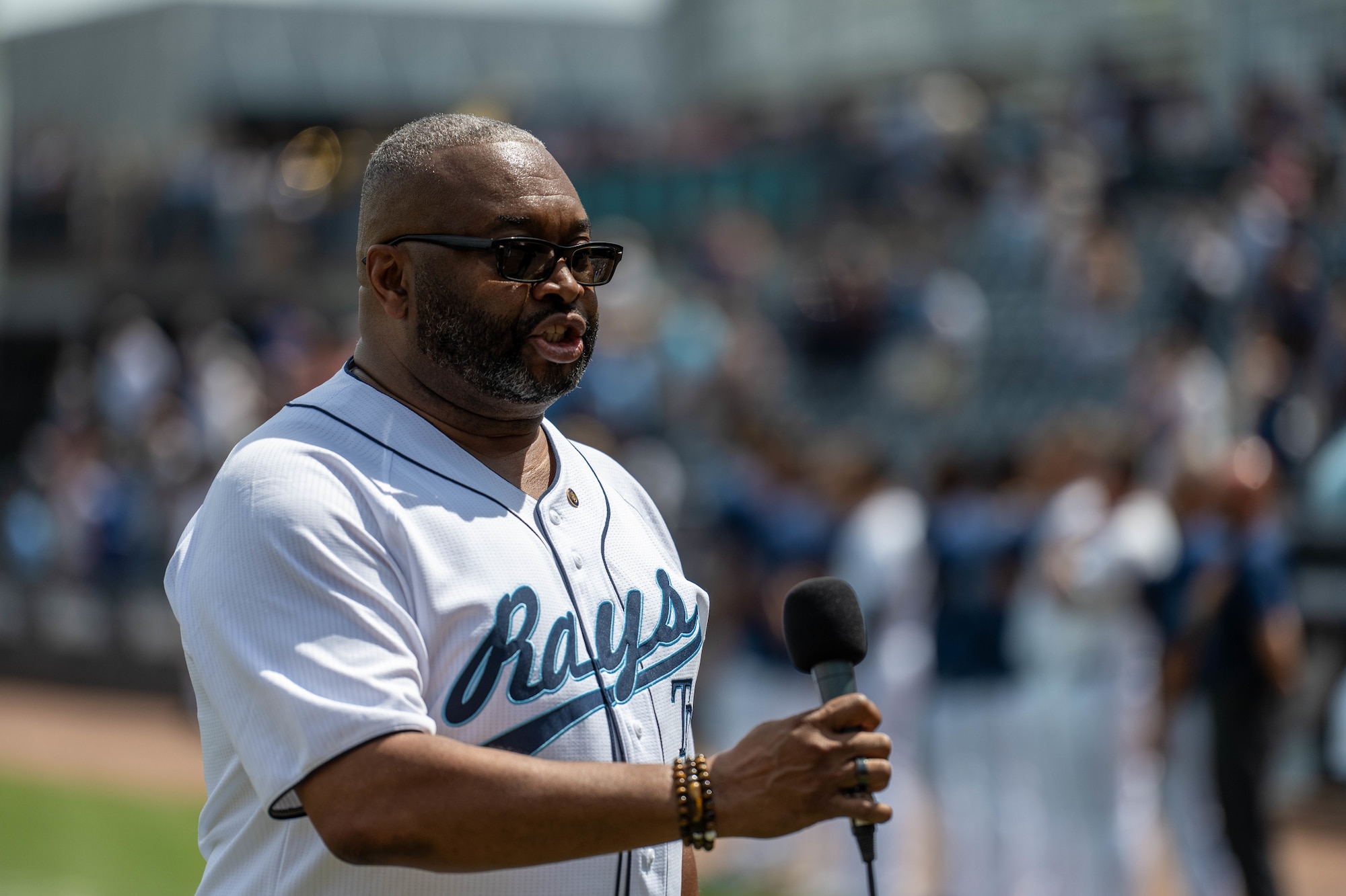Laron Washington, 6th Air Refueling Wing Equal Opportunity director, performs the national anthem during the Tampa Bay Rays baseball game in Tampa, Florida, Sept. 18, 2025. The event strengthened the bond between MacDill Air Force Base and the local community, showcasing mutual respect and support. (U.S. Air Force photo by Staff Sgt. Christopher Tam)