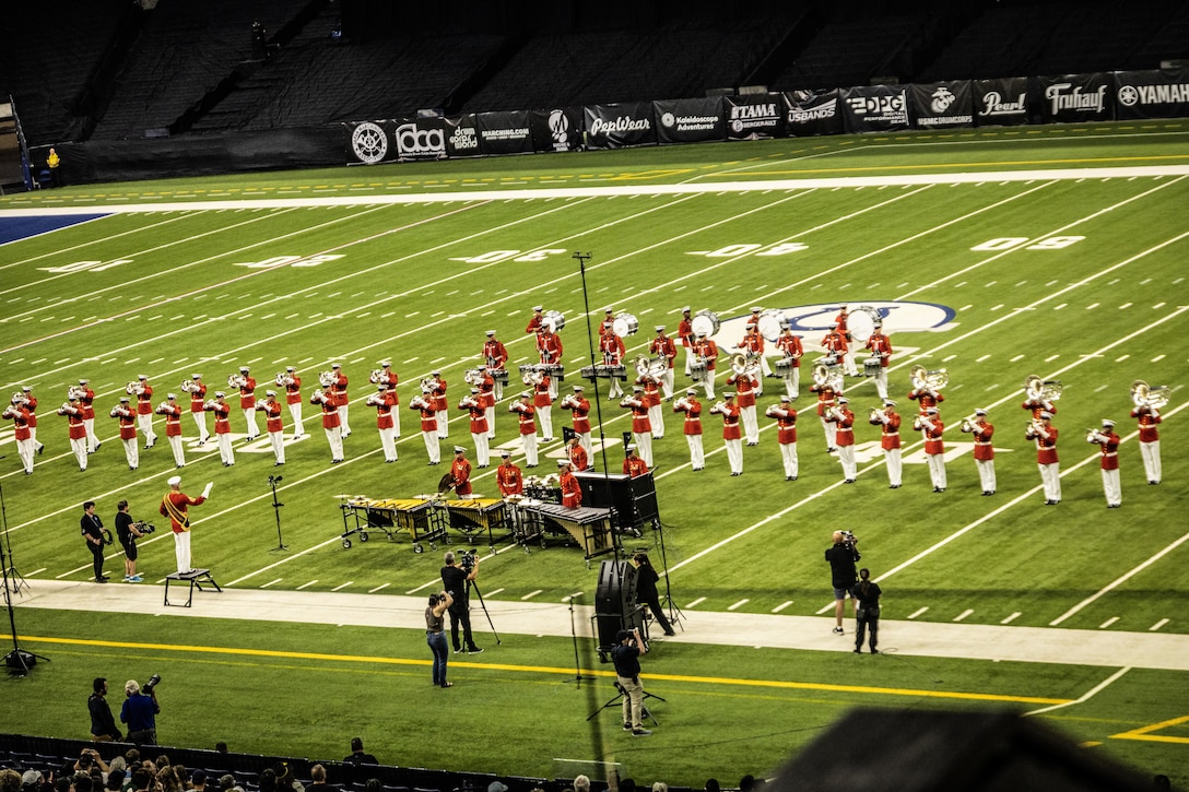 U.S. Marine Corps Drum & Bugle Corps, Marine Barracks Washington, perform during the Drum Corps International World Championship in Indianapolis, August 9, 2025. The ensemble, known as “The Commandant’s Own,” showcased their musical precision, discipline and professionalism, captivating an audience of thousands gathered to witness top drum corps from around the world. (U.S. Marine Corps photo by Sgt. Devin Horton)