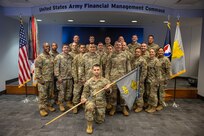 Soldiers of the U.S. Army Financial Management Command’s 45th Finance Center pose for a photo in the Mark Sullivan Auditorium at the Maj. Gen. Emmett J. Bean Federal Center in Indianapolis Sept. 18, 2025. The four-day exercise brought together elements from the 45th FC’s headquarters and three geographically separated teams to assess the unit’s operational capacity and limitations while enhancing its future operational reach for large scale and multidomain operations. (U.S. Army photo illustration by Mark R. W. Orders-Woempner)