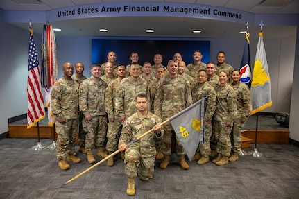Soldiers of the U.S. Army Financial Management Command’s 45th Finance Center pose for a photo in the Mark Sullivan Auditorium at the Maj. Gen. Emmett J. Bean Federal Center in Indianapolis Sept. 18, 2025. The four-day exercise brought together elements from the 45th FC’s headquarters and three geographically separated teams to assess the unit’s operational capacity and limitations while enhancing its future operational reach for large scale and multidomain operations. (U.S. Army photo illustration by Mark R. W. Orders-Woempner)
