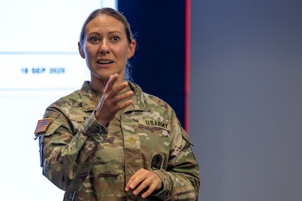 Maj. Sonja Keith, 45th Finance Center finance operations chief, delivers remarks during a staff exercise in the Mark Sullivan Auditorium at the Maj. Gen. Emmett J. Bean Federal Center in Indianapolis Sept. 18, 2025. The four-day exercise brought together elements from the 45th FC’s headquarters and three geographically separated teams to assess the unit’s operational capacity and limitations while enhancing its future operational reach for large scale and multidomain operations. (U.S. Army photo by Mark R. W. Orders-Woempner)