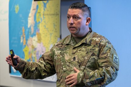 Sgt. Maj. Jaime Perez, U.S. Army Financial Management Command Reserve Component finance and comptroller senior enlisted advisor, briefs 45th Finance Center Soldiers about the Army Reserve’s and National Guard’s role in finance operations during a staff exercise in the Mark Sullivan Auditorium at the Maj. Gen. Emmett J. Bean Federal Center in Indianapolis Sept. 18, 2025. The four-day exercise brought together elements from the 45th FC’s headquarters and three geographically separated teams to assess the unit’s operational capacity and limitations while enhancing its future operational reach for large scale and multidomain operations. (U.S. Army photo by Mark R. W. Orders-Woempner)