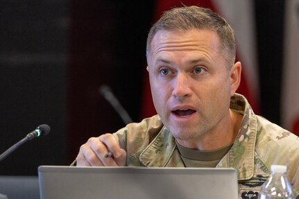 Maj. Daniel Nixon, 12th Finance Operations Center director from Fort Knox, Kentucky, makes remarks during a staff exercise in the Mark Sullivan Auditorium at the Maj. Gen. Emmett J. Bean Federal Center in Indianapolis Sept. 18, 2025. The four-day exercise brought together elements from the 45th FC’s headquarters and three geographically separated teams to assess the unit’s operational capacity and limitations while enhancing its future operational reach for large scale and multidomain operations. (U.S. Army photo by Mark R. W. Orders-Woempner)