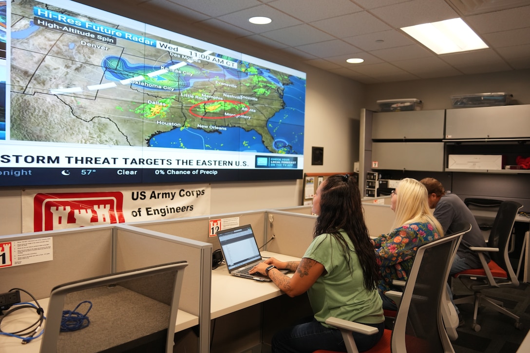 (From left to right) Adrienne Bostic, emergency management specialist, Sharon Rader, emergency management admin, and Kevin Gatlin, emergency management specialist, monitor weather forecasts and coordinate disaster preparedness efforts at the U.S. Army Corps of Engineers Nashville District office in Nashville, Tenn., on Sept. 24, 2025.