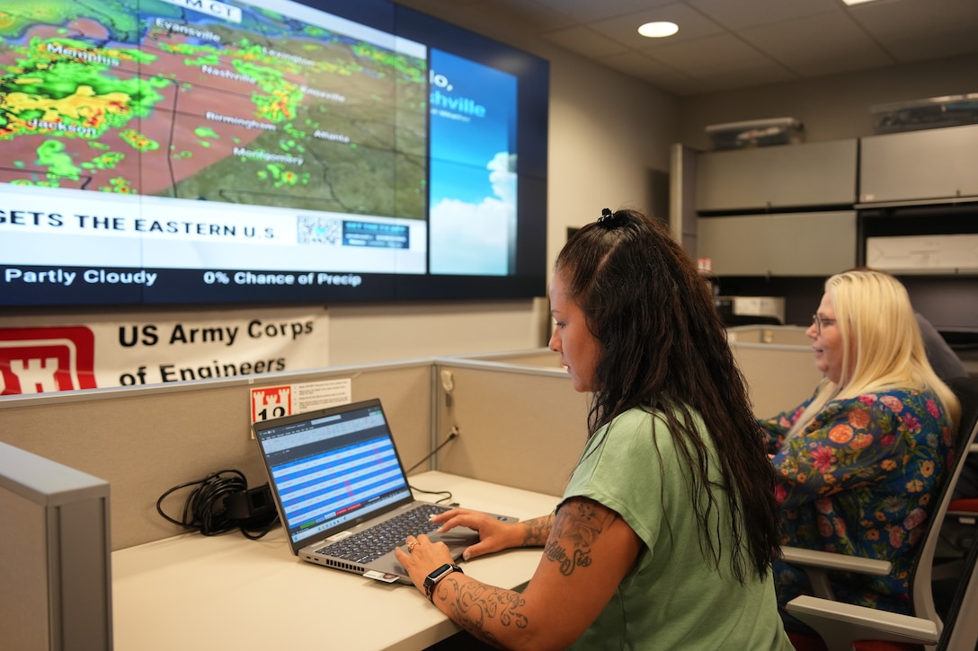 (From left to right) Adrienne Bostic, emergency management specialist, Sharon Rader, emergency management admin, and Kevin Gatlin, emergency management specialist, monitor weather forecasts and coordinate disaster preparedness efforts at the U.S. Army Corps of Engineers Nashville District office in Nashville, Tenn., on Sept. 24, 2025.