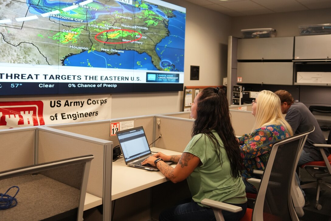 (From left to right) Adrienne Bostic, emergency management specialist, Sharon Rader, emergency management admin, and Kevin Gatlin, emergency management specialist, monitor weather forecasts and coordinate disaster preparedness efforts at the U.S. Army Corps of Engineers Nashville District office in Nashville, Tenn., on Sept. 24, 2025.