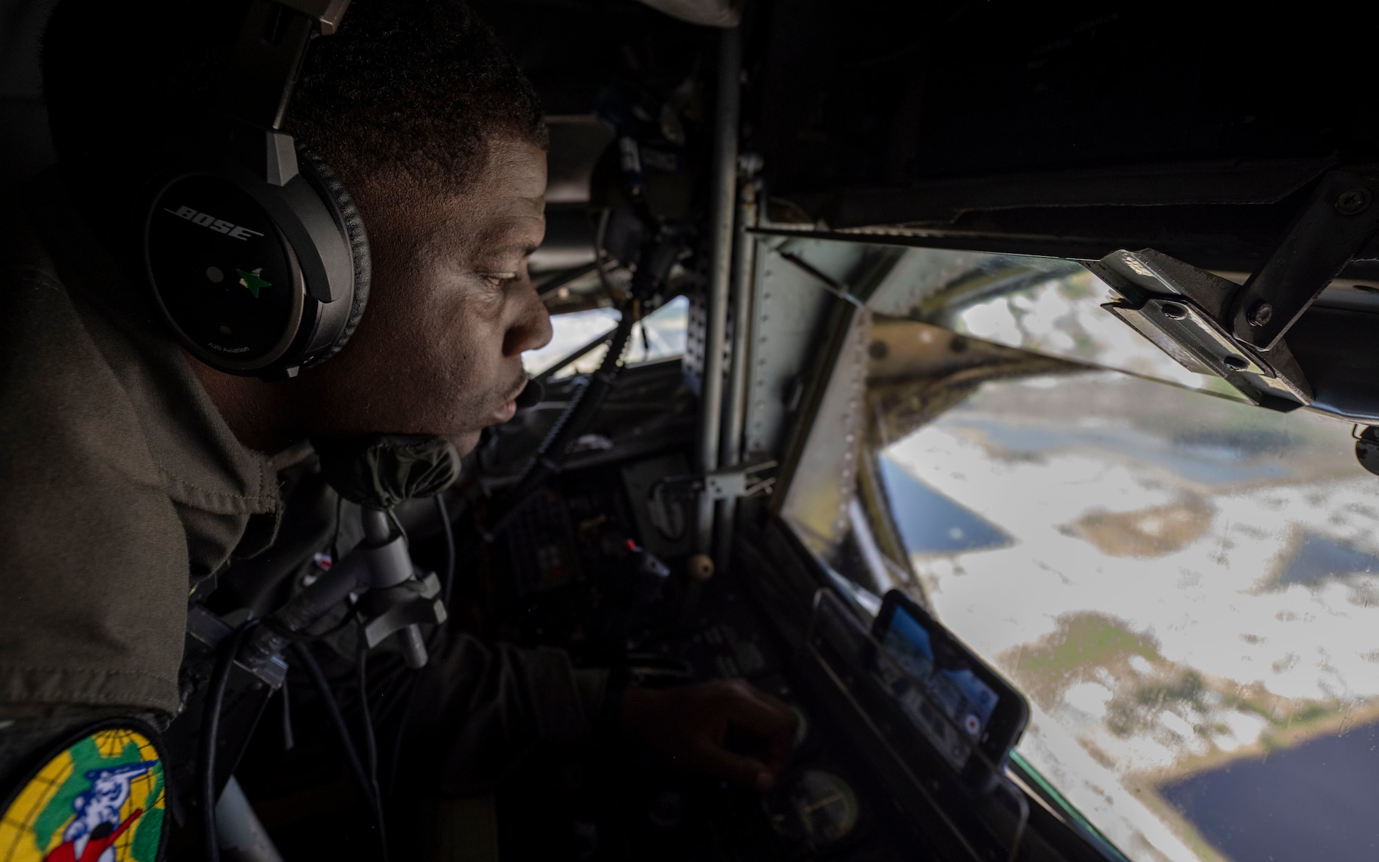 U.S. Air Force Senior Airman Detavian Daniels, a 91st Air Refueling Squadron boom operator, overlooks Tampa Bay during a flyover of George M. Steinbrenner Field in Tampa, Florida, Sept. 18, 2025. The flyover honored military service and celebrated the enduring partnership between MacDill Air Force Base and the local Tampa Bay community. (U.S. Air Force photo by Airman 1st Class Monique Stober)