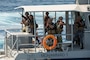 U.S. CENTRAL COMMAND AREA OF RESPONSIBILITY (Sept. 17, 2025) U.S. Coast Guardsmen assigned to U.S. Naval Forces Central Command’s Maritime Engagement Team and members of the Jordanian Armed Forces participate in a simulated visit, board, search, and seizure (VBSS) operation aboard a Royal Jordanian Naval Forces vessel in the Gulf of Aqaba, Sept. 17, 2025, during exercise INFINITE DEFENDER 25. INFINITE DEFENDER 25 is an annual, bilateral explosive ordnance disposal and maritime security exercise between U.S. 5th Fleet and the Royal Jordanian Navy to enhance mutual capabilities and interoperability. (U.S. Army photo by Sgt. Hans Williams)