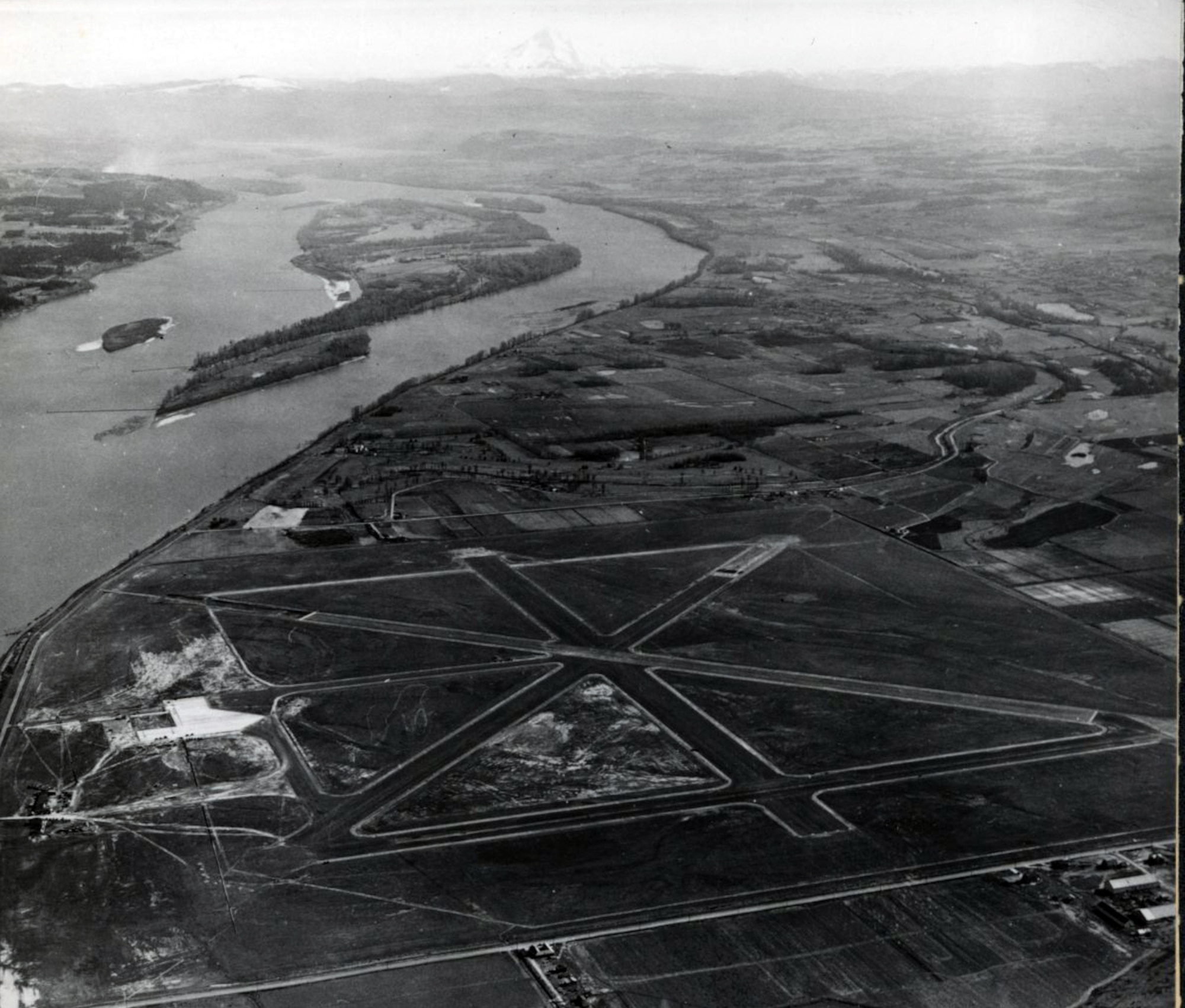 Aerial view of the Portland-Columbia Airport taken in March, 1940, which replaced Portland’s Swan Island Municipal Airport.  Just over a year later, on April 13, 1941 Portland Army Air Base was activated at the new Portland-Columbia Airport as the United States sought to improve military readiness.  (Courtesy Oregon Historical Society Research Lib., 014394)