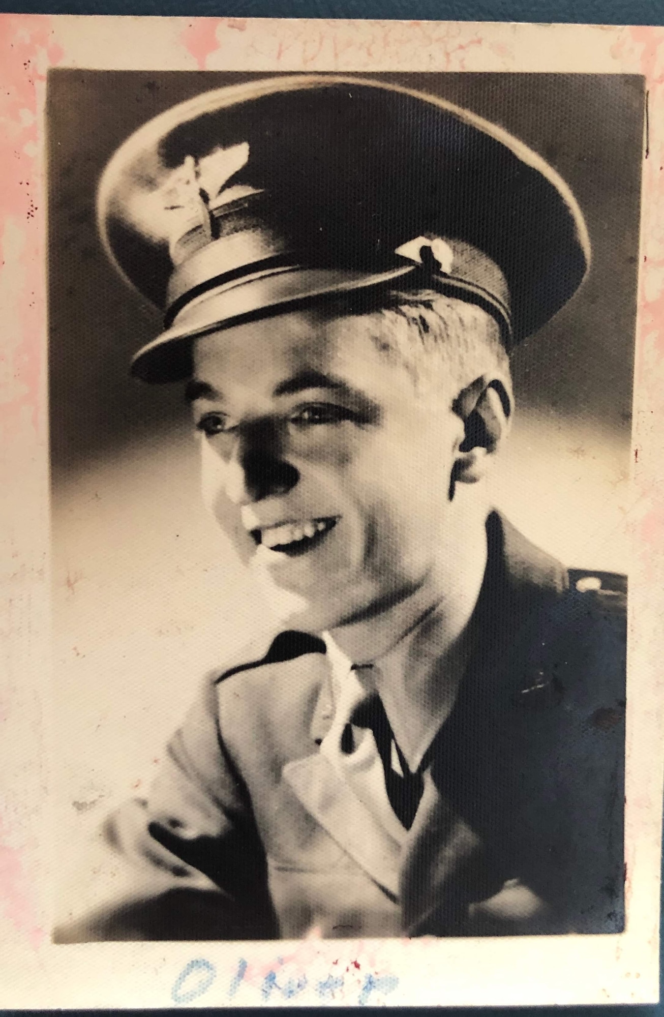 A service member poses for an official photo.
