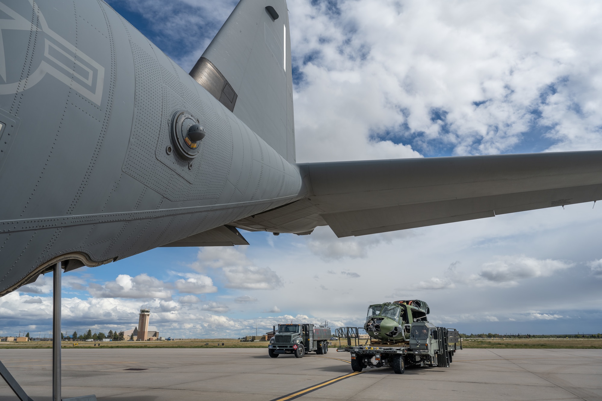 U.S. Air Force Airmen from the 317th Airlift Wing and 153rd AW load a UH-1 helicopter onto a C-130J Super Hercules at Wyoming Air National Guard Base in Cheyenne, Wyo., Sept. 17, 2025. The helicopter, previously assigned to the 90th Missile Wing at F.E. Warren Air Force Base in Cheyenne, was transported by the 317th AW to the 436th Training Squadron’s crash lab at Dyess Air Force Base, Texas. (U.S. Air Force photo by Airman 1st Class Caleb Schellenberg)