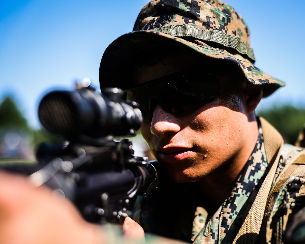 U.S. Marine Corps Lance Cpl. Joshua Velasco, a rifleman with 1st Platoon, Guard Company, Marine Barracks Washington, conducts land navigation training at Marine Corps Base Quantico, Va., June 25, 2025. The training enhances Marines’ ability to navigate unfamiliar terrain using a map and compass, reinforcing individual readiness and field skills. (U.S. Marine Corps photo by Lance Cpl. Brynn L. Bouchard)