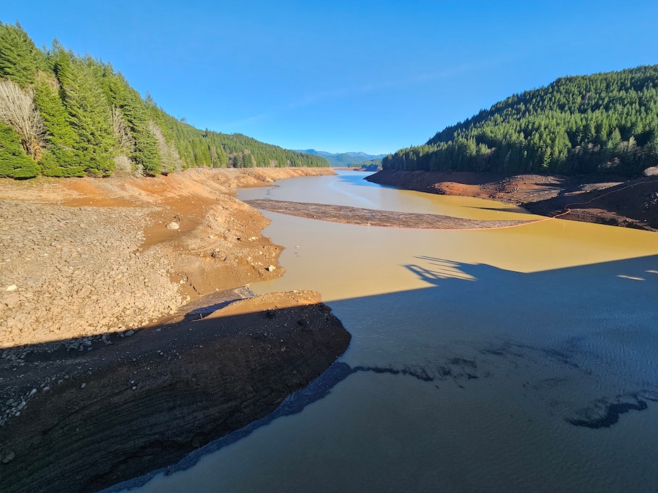 Green Peter reservoir is shown during the deep drawdown in 2023, when reservoir levels were lowered to help endangered salmon exit the reservoirs.  The historic drawdown exposed the lakebed and increased sediment movement downriver.