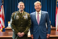 Command Sgt. Maj. Jon A. Ring stands with Georgia Gov. Brian Kemp during a Soldier’s Medal ceremony at the Georgia State Capitol in Atlanta, Sept. 22, 2025.