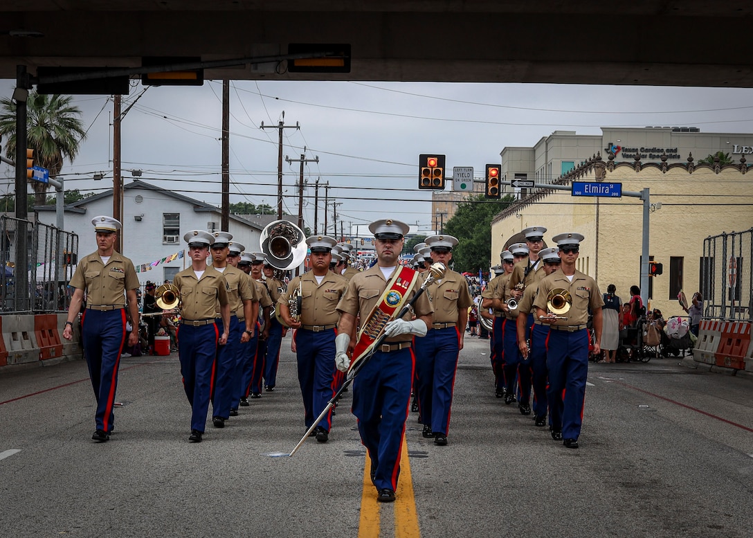 U.S. Marine Corps musicians from Marine Forces Reserve Band perform during The Battle of Flowers Parade, San Antonio, Texas, May 2, 2025. The Battle of Flowers Parade is the founding event of Fiesta San Antonio and commemorates the heroes of the Alamo, Goliad, and the Battle of San Jacinto, and has evolved into a vibrant spectacle with spectacular floats, marching bands, and other attractions.  (U.S. Marine Corps photo by Sgt. Jacqueline Peguero-Montes)