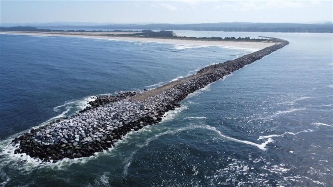 Head of the Coos Bay North Jetty jutting out into the ocean.