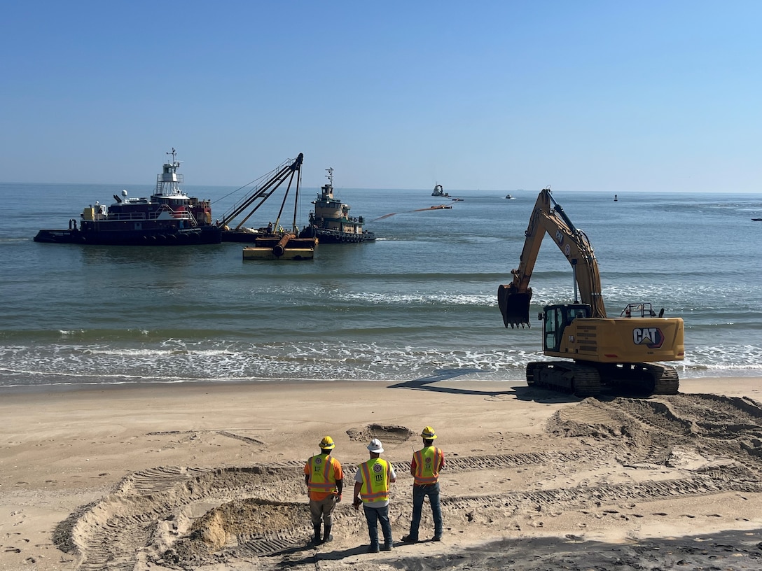 The U.S. Army Corps of Engineers Philadelphia District and its contractor Great Lakes Dredge & Dock Company execute a subline landing as part of dredging and beachfill operations at the north shore of the Indian River Inlet in Sussex County, DE. Work is designed to reduce the risk of coastal storm damages to infrastructure, including Route 1 and the Indian River Inlet Bridge. (Photo by Jared Jernegan).