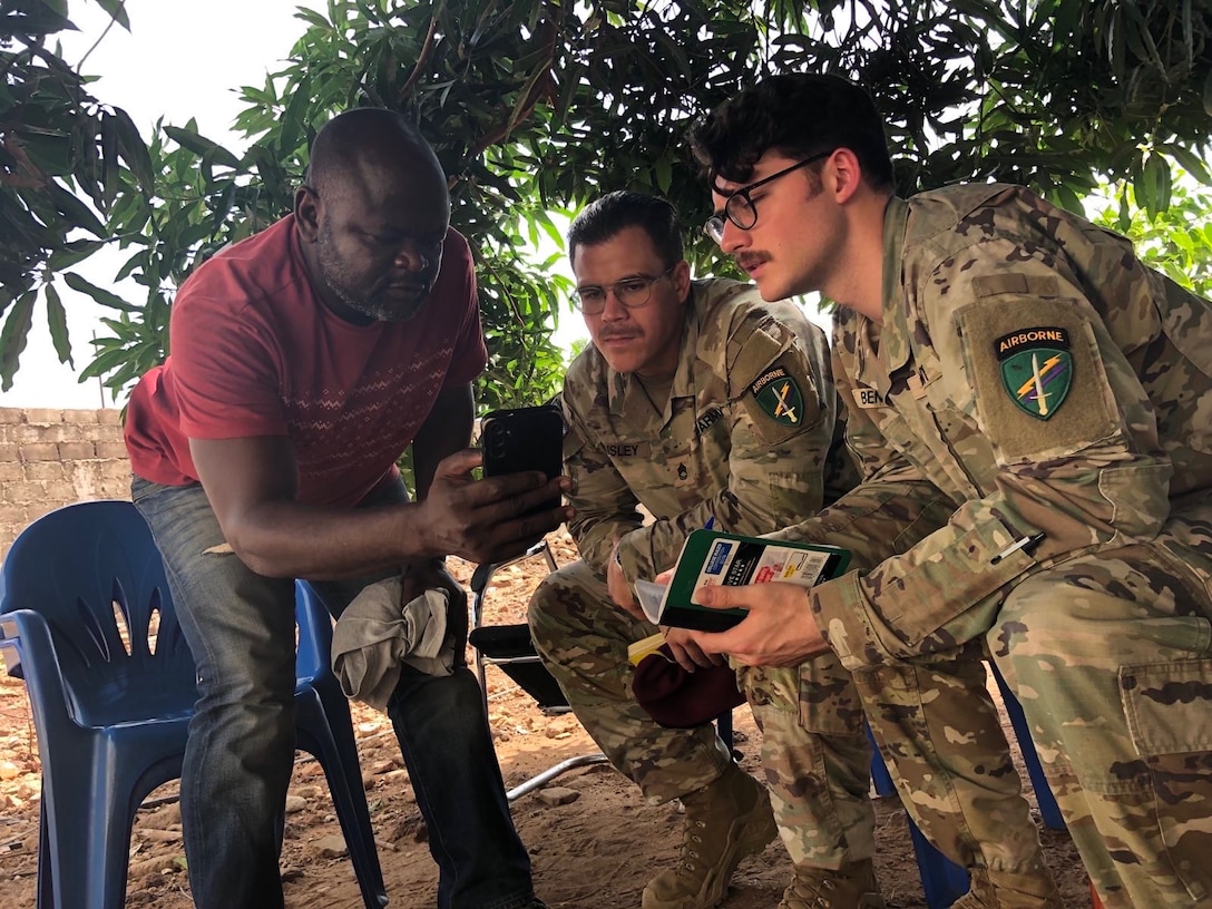 SETAF-AF civil affairs NCO translates French for his team in West Africa