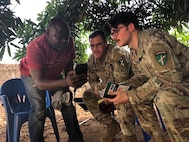 SETAF-AF civil affairs NCO translates French for his team in West Africa