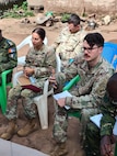 SETAF-AF civil affairs NCO translates French for his team in West Africa