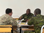 SETAF-AF civil affairs NCO translates French for his team in West Africa