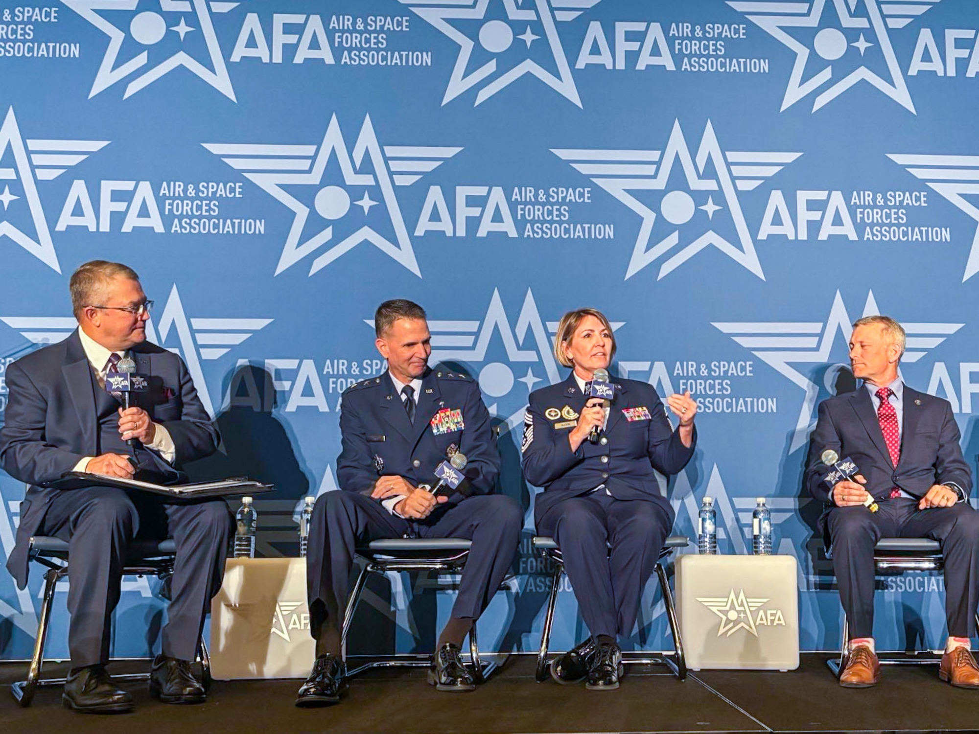 Chief Master Sgt. Katie McCool, Pacific Air Forces command chief, answers questions during a panel at Air and Space Force Association’s Warfare Symposium on Sept. 23, 2025. McCool shared her mission to connect families and communities with units, and ensuring they have full access to national and local resources. (U.S. Air Force photo by Capt. Ethan Harris)