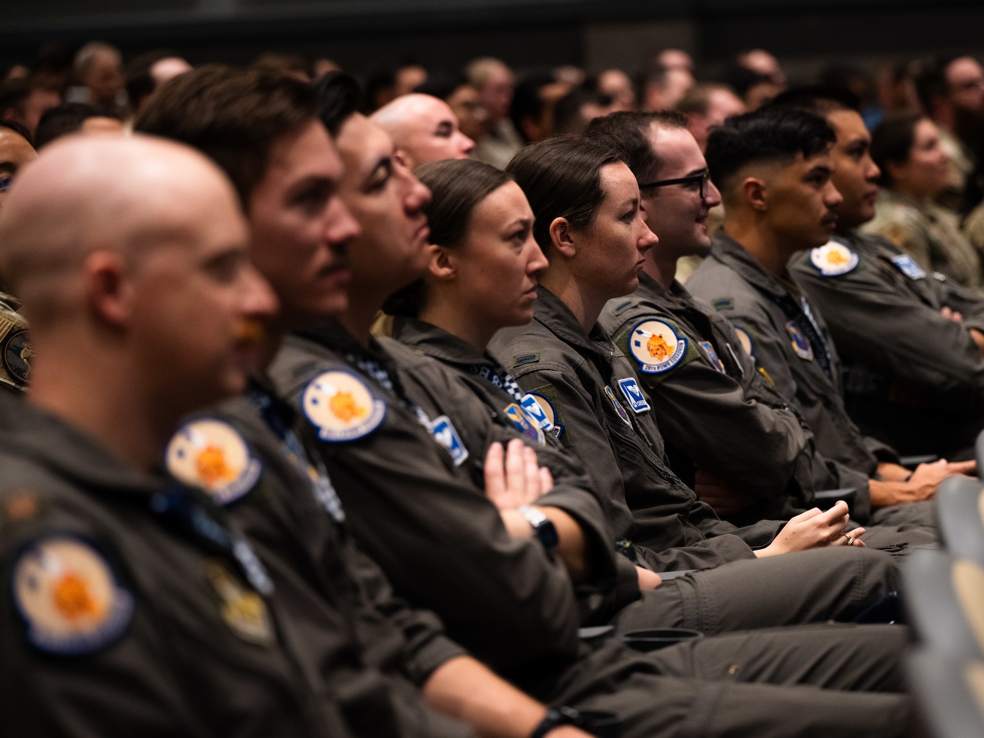 U.S. Airmen assigned to the 28th Bomb Squadron attend a briefing on the future of the B-1B Lancer during Striker Day at Dyess Air Force Base, Texas, Sept. 19, 2025. As the Formal Training Unit for the B-1B, the 28th BS trains all pilots and weapons systems officers assigned to the aircraft. (U.S. Air Force photo by Senior Airman Jade M. Caldwell)