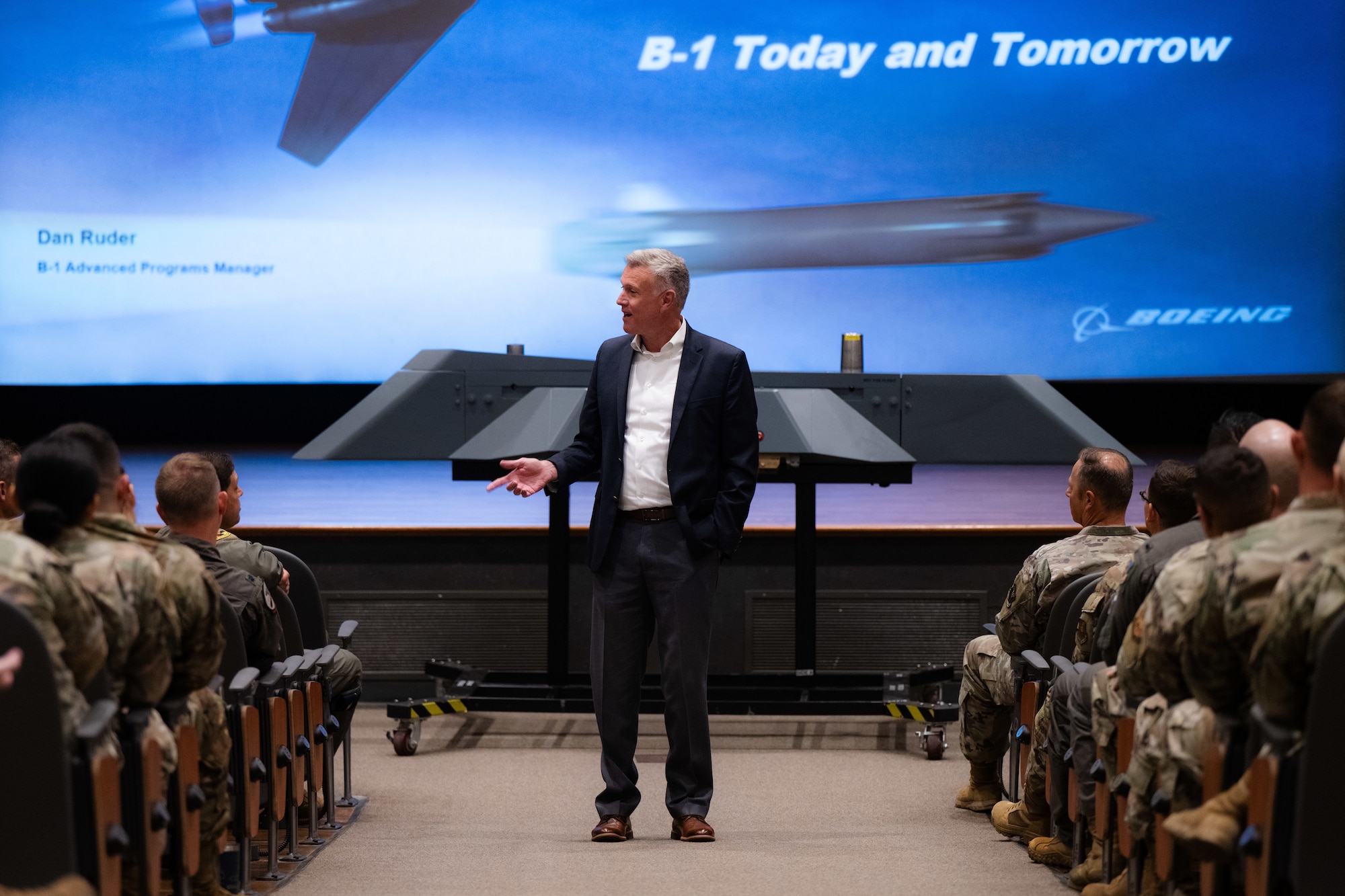 Robert Gass, Boeing strategic development and investment manager and former 7th Bomb Wing commander, speaks to 7th BW Airmen and Abilene community leaders about the B-1B Lancer during Striker Day at Dyess Air Force Base, Texas, Sept. 19, 2025. Boeing discussed current B-1B modernizations concepts and implementation plans to sustain combat credibility.  (U.S. Air Force photo by Senior Airman Jade M. Caldwell)
