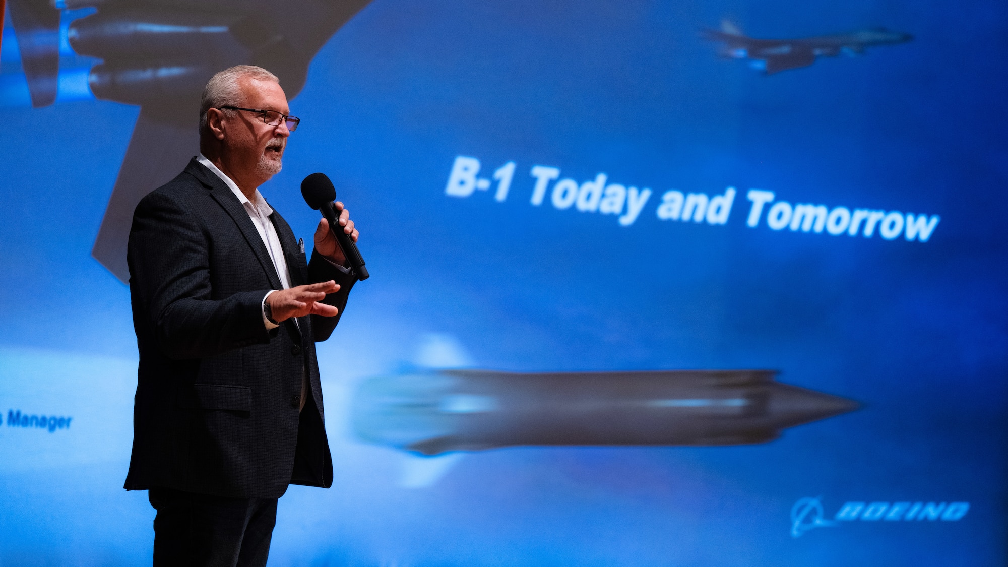Dan Ruder, Boeing advanced programs manager, speaks to 7tht Bomb Wing Airmen and Abilene community leaders about the B-1B Lancer during Striker Day at Dyess Air Force Base, Texas, Sept. 19, 2025. Boeing discussed current B-1B modernizations concepts innovations and implementation plans to sustain combat credibility. (U.S. Air Force photo by Senior Airman Jade M. Caldwell)