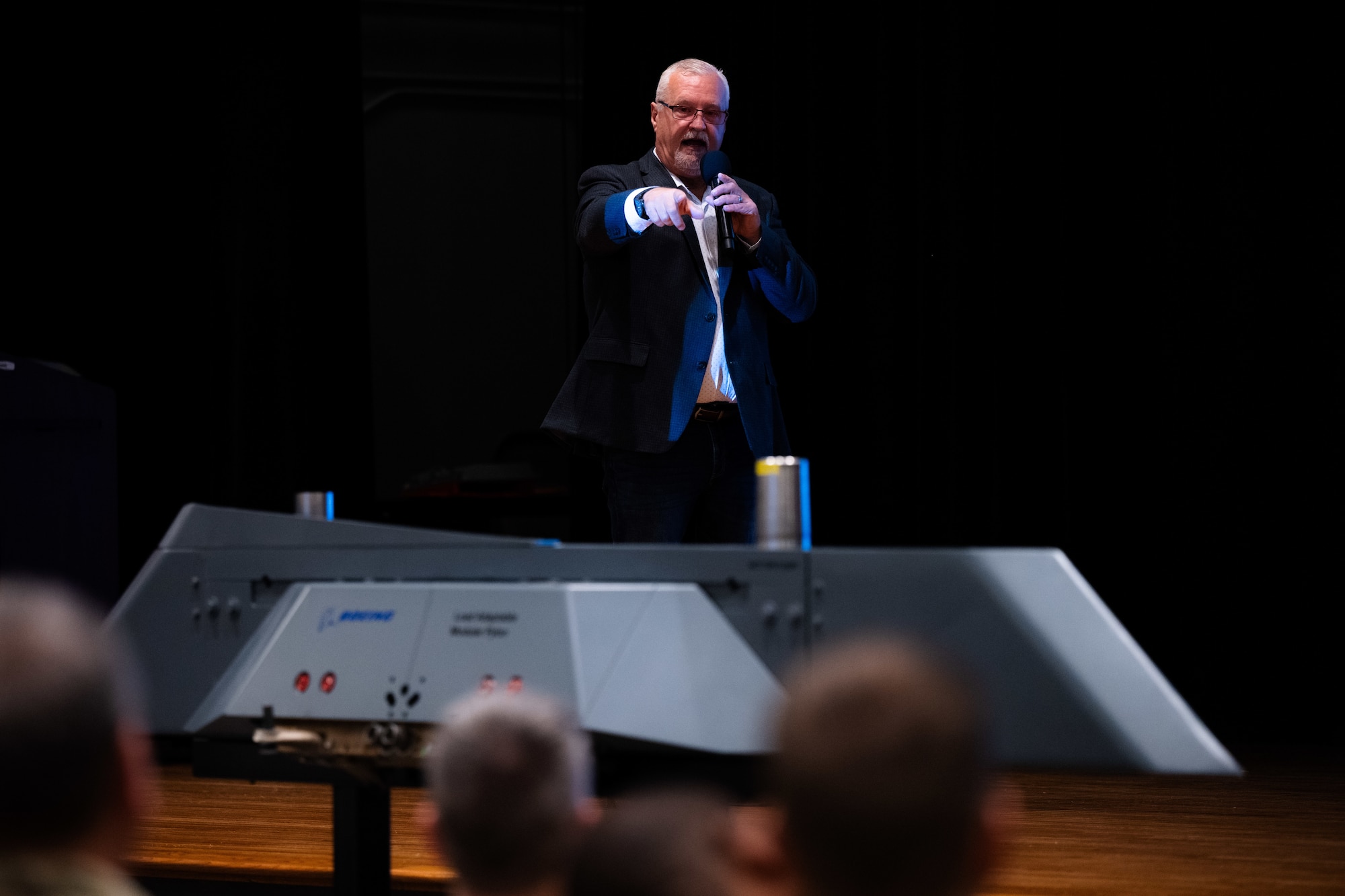 Dan Ruder, Boeing advanced programs manager, explains a new Load Adaptable Modular pylon for the B-1B Lancer during Striker Day at Dyess Air Force Base, Texas, Sept.19, 2025. The modular pylon is designed to expand external carriage options and increase weapons payload flexibility as the Air Force modernizes its long-range strike fleet. (U.S. Air Force photo by Senior Airman Jade M. Caldwell)