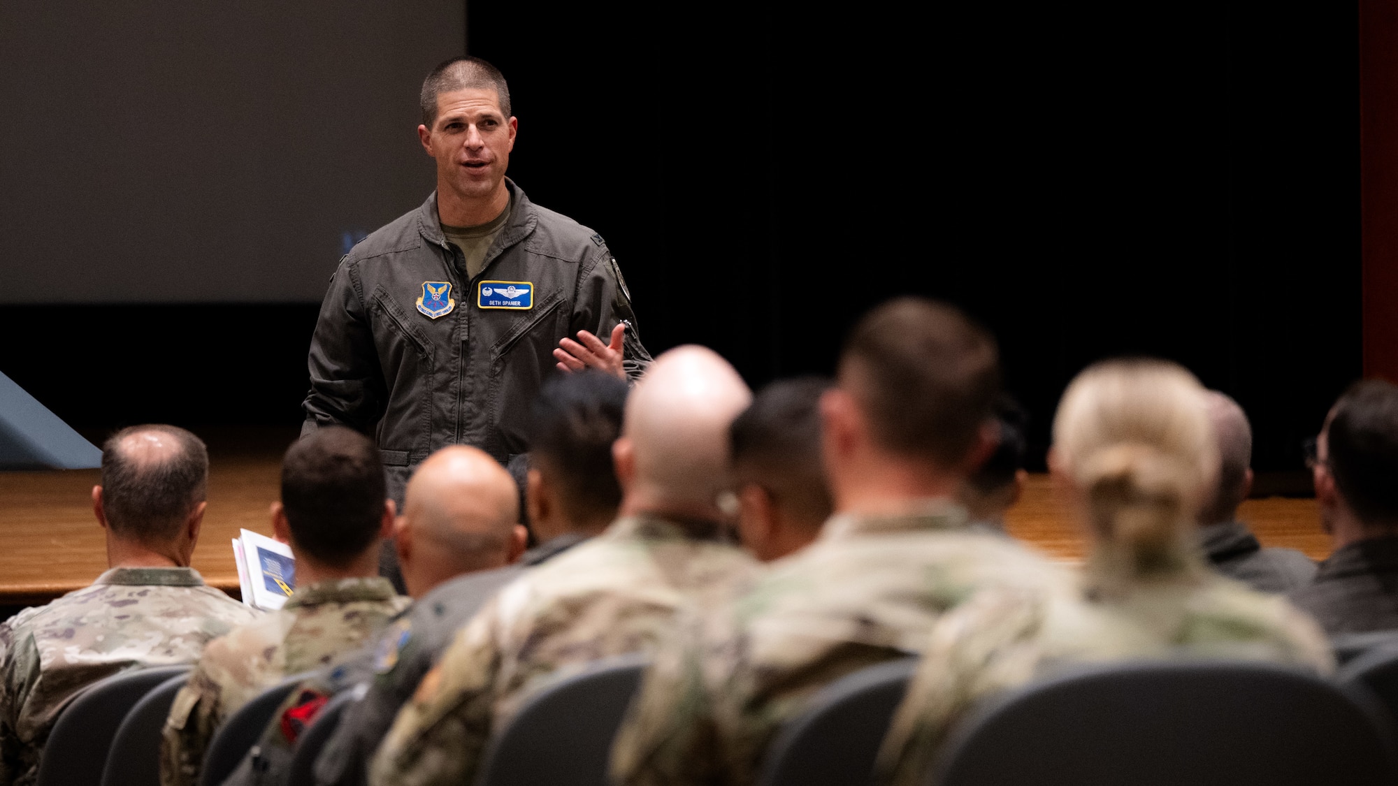 U.S. Air Force Col. Seth Spanier, 7th Bomb Wing commander, speaks with Airmen and Abilene community leaders during Striker Day at Dyess Air Force Base, Texas, Sept. 19, 2025. The event focused on new B-1B Lancer capabilities and the bomber’s vital role in the future as America's long-range strike force evolves, bridging the gap to the future with the B-21 Raider.  (U.S. Air Force photo by Senior Airman Jade M. Caldwell)