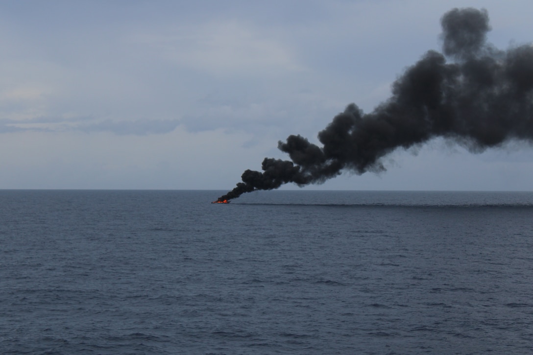 A go-fast vessel burns the day after the crew of Coast Guard Cutter Diligence (WMEC 616) interdicted the suspected drug smuggling vessel in the Caribbean Sea, Sept. 7, 2025. Diligence’s crew disrupted the go-fast style panga, suspected of trafficking more than 8,700 pounds of cocaine, worth nearly $64.5 million. (U.S. Coast Guard photo)