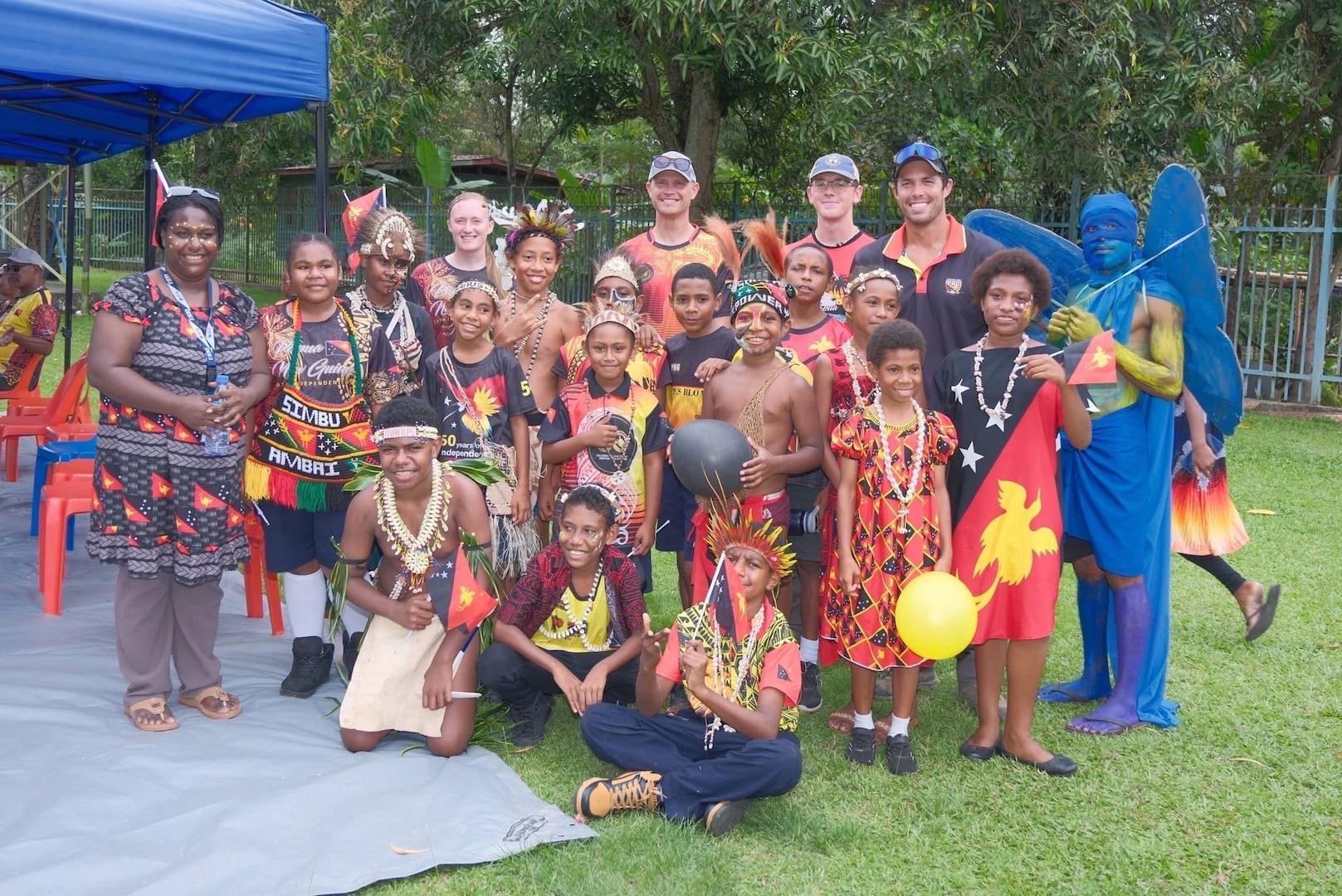 Members of Defense POW/MIA Accounting Agency mission 25-4PG pose for a photo during a celebration for Papua New Guinea's 50th Independence Day on Sept. 16, 2025.