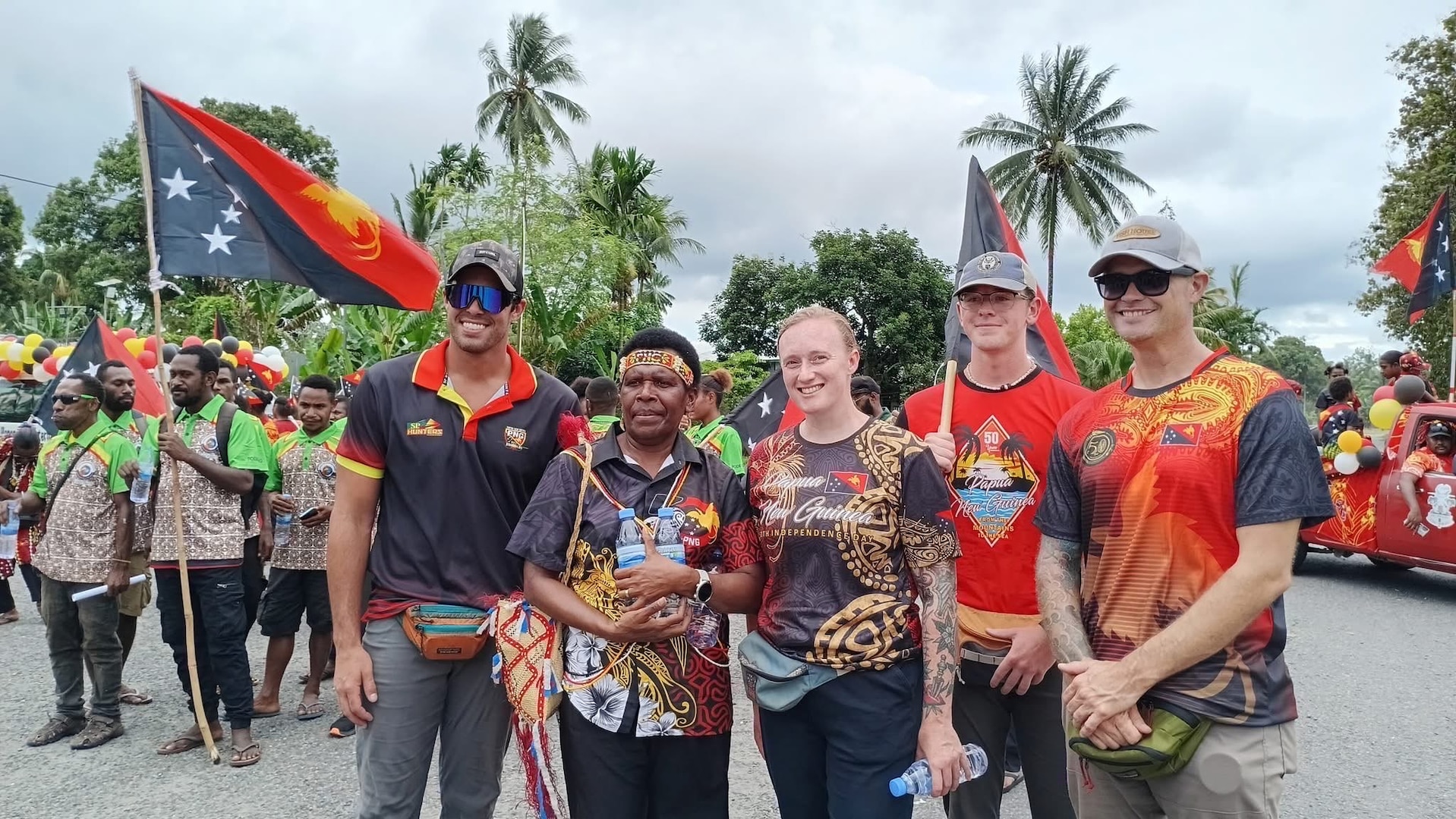 Members of Defense POW/MIA Accounting Agency mission 25-4PG pose for a photo during a celebration for Papua New Guinea's 50th Independence Day on Sept. 16, 2025.