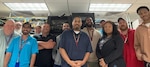The Defense Health Agency team and Kenner's Information Management Department stand together after successfully completing the clinic-wide network upgrade.