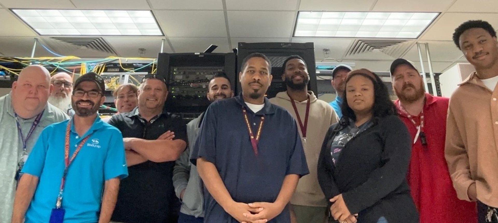 The Defense Health Agency team and Kenner's Information Management Department stand together after successfully completing the clinic-wide network upgrade.