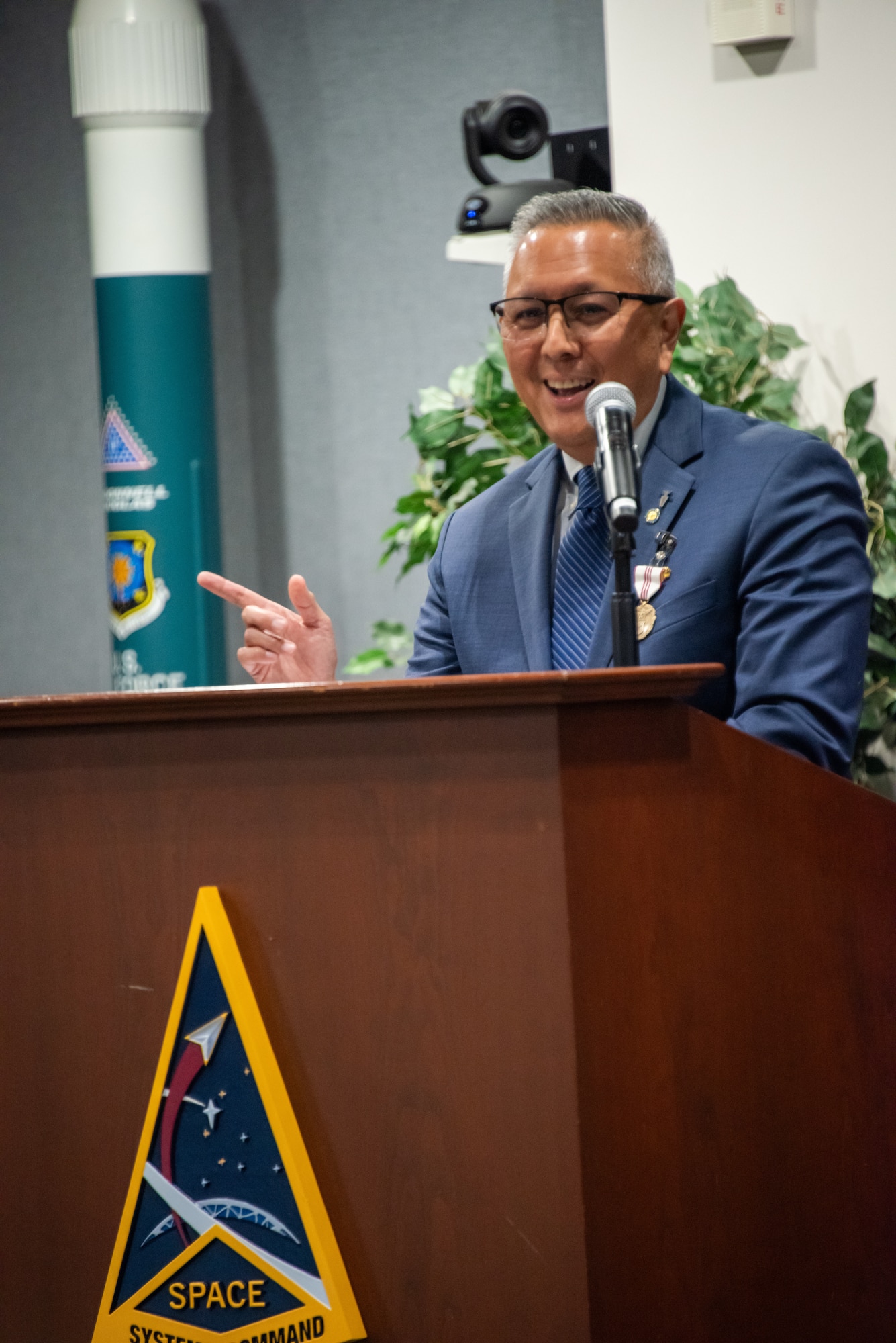 Mr. Cordell A. DeLaPena Jr., program executive officer (PEO) for Military Communications and Positioning, Navigation, and Timing (MILCOMM & PNT) at SSC, addresses the audience during his retirement from federal service at Los Angeles Air Force Base, El Segundo, Calif., August 28, 2025. DeLaPena’s retirement comes after a distinguished career spanning four decades of service to the nation, with his role at SSC exemplifying commitment to delivering innovative solutions that empower warfighters by delivering next-generation space capabilities that are resilient, sustainable, and adaptable to meet the evolving needs of the joint force. (U.S. Space Force photo by Jason Slawson).