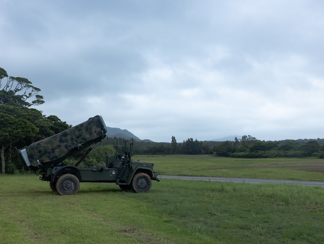 U.S. Marines with 3d Marine Division execute a notional fire mission with the Navy-Marine Expeditionary Ship Interdiction System during an Expeditionary Advanced Base Field Training Exercise at the Central Training Area, Camp Hansen, Okinawa, Japan, July 28, 2025.  The NMESIS is a ground-based offensive anti-ship missile system, used in sea denial and littoral protection to offer a highly mobile and rapidly deployable island defense solution.  (U.S. Marine Corps photo by Cpl. Lucas Lu)