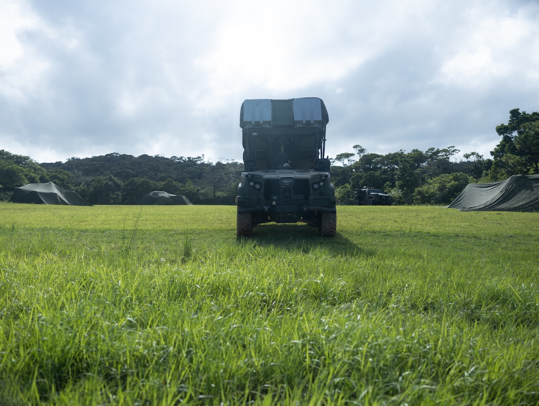 U.S. Marines execute a notional fire mission with the Navy-Marine Expeditionary Ship Interdiction System during an Expeditionary Advanced Base Field Training Exercise at the Central Training Area, Camp Hansen, Okinawa, Japan, July 28, 2025.  The NMESIS system is a ground-based offensive anti-ship missile system, used in sea denial and littoral protection to offer a highly mobile and rapidly deployable island defense solution. This NMESIS system is a 3d Marine Division asset. (U.S. Marine Corps photo by Cpl. Lucas Lu)