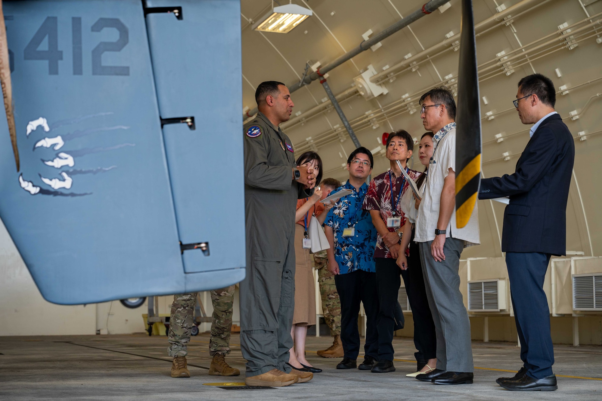 U.S. Air Force Lt. Col. Christopher Saltares, 319th Expeditionary
Reconnaissance Squadron commander, briefs Mr. Masaru Murai, Okinawa Defense Bureau director general, on MQ-9 Reaper capabilities during a familiarization tour at Kadena Air Base, Sept. 11, 2025.