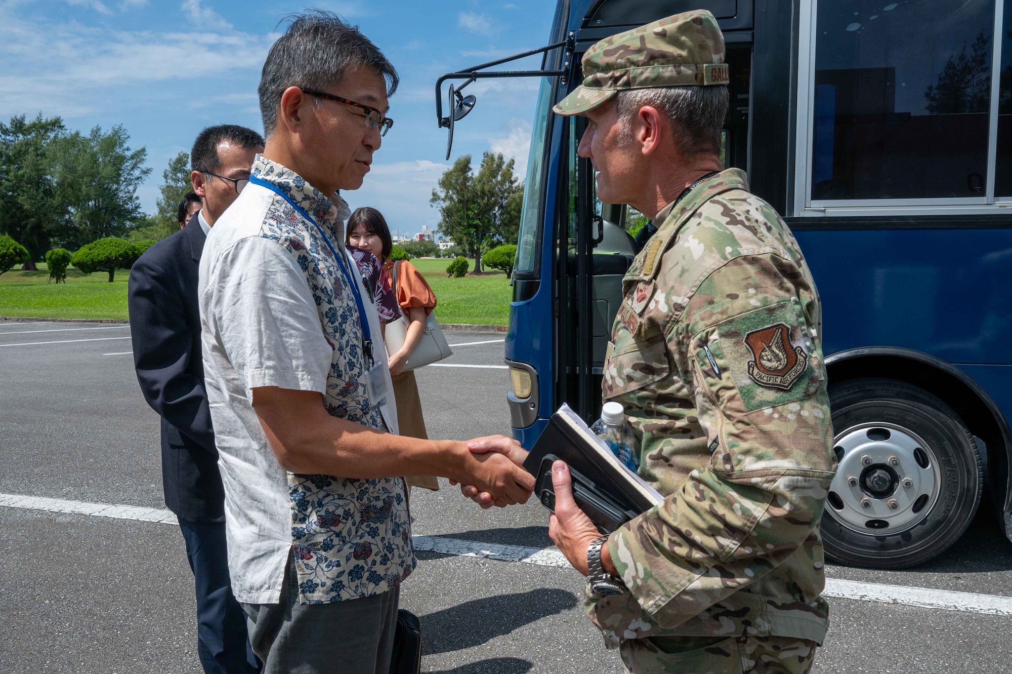 Mr. Masaru Murai, Okinawa Defense Bureau director general, bids farewell to Brig. Gen. John Gallemore, 18th Wing commander, after a familiarization tour at Kadena Air Base, Sept. 11, 2025.