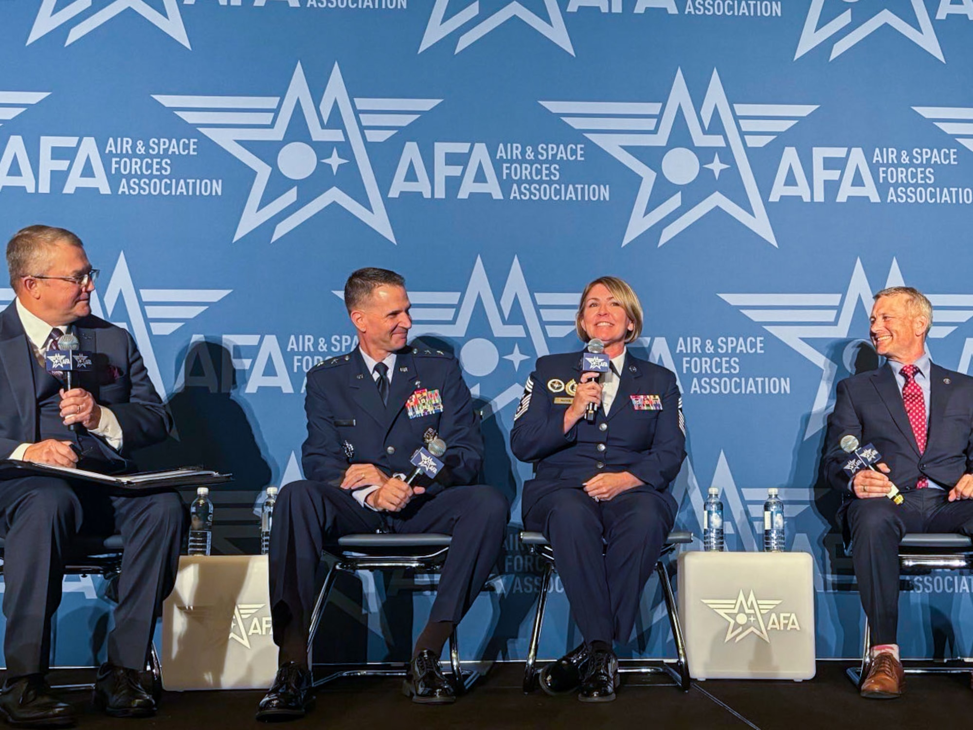Chief Master Sgt. Katie McCool, Pacific Air Forces command chief, answers questions during a panel at Air and Space Force Association’s Warfare Symposium on Sept. 23, 2025. McCool highlighted that while the Air Force prepares for future operational challenges, a parallel focus on family readiness is necessary to ensure that families and communities connected to our units are as well prepared as service members. (U.S. Air Force photo by Capt. Ethan Harris)