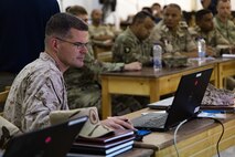 U.S. Marine Corps Maj. Aric Ramsey, Task Force 51/5 lead planner for Exercise BRIGHT STAR 25’s Command Post Exercise, reviews the day’s events during the U.S. Navy HICON end of day brief at the Mohamed Naguib Military Base (MNMB) Egypt, Sept. 6, 2025.